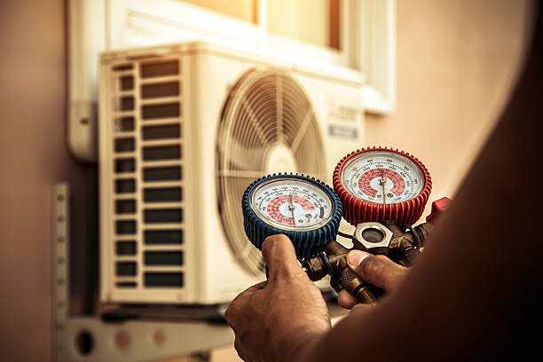 Professional Heat Pump Repair technician working in Fosters, AL